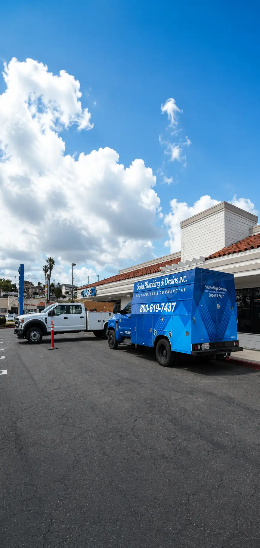 Solid Plumbing & Drains service truck outside a commercial property