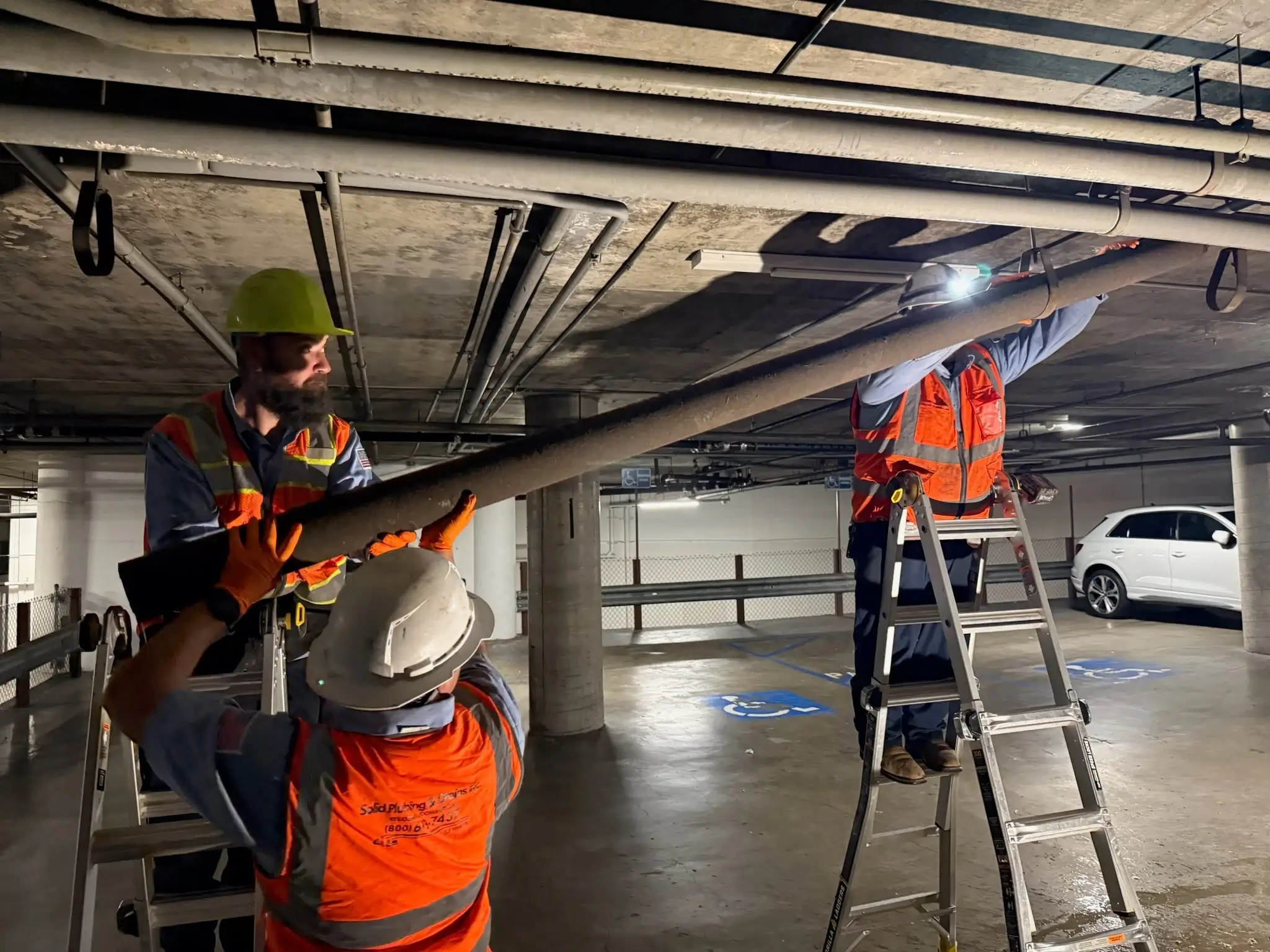 Solid Plumbing technicians working at a commercial plumbing job site
