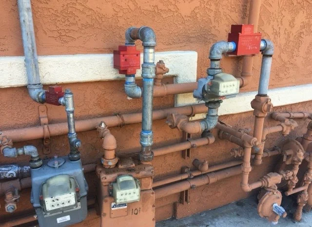 Exterior gas meters and gas piping for a San Diego property