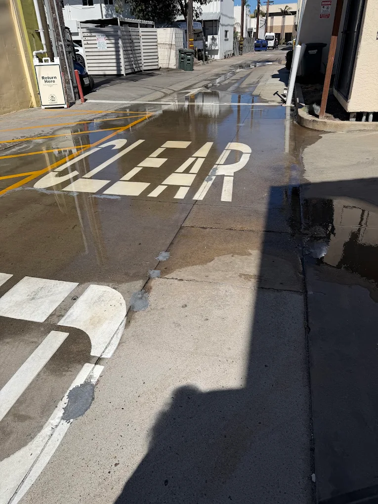 Standing water from an emergency plumbing leak in San Diego